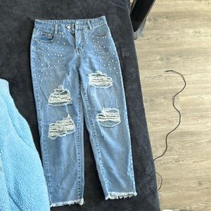 Blue ripped jeans with gems